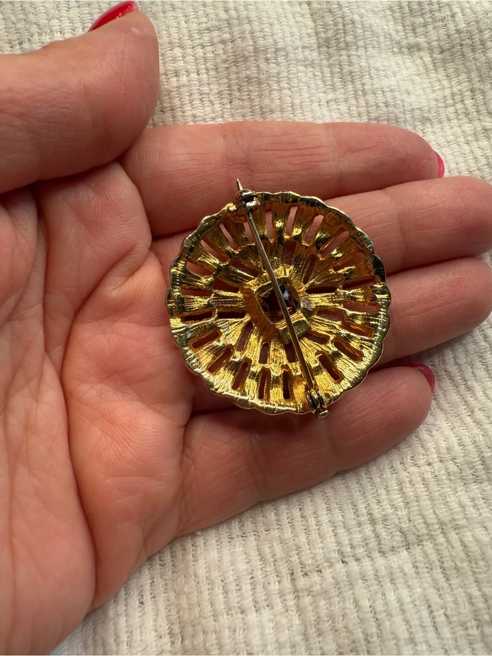 Medieval Romantic Style 1970s Goldtone Brooch with a Ruby Red Stone